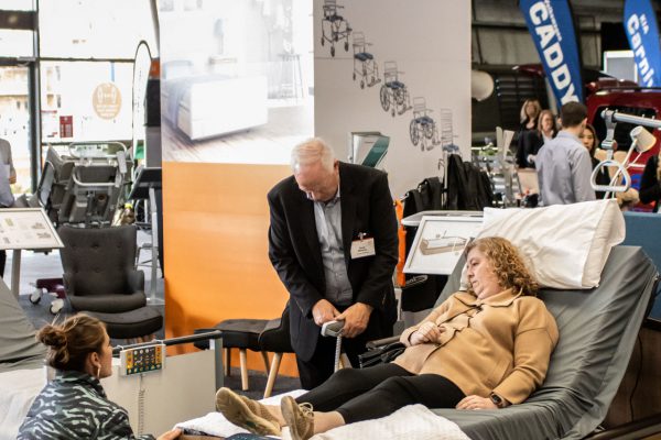 An image of two ATSA Expo visitors testing an accessible bed at the Crescent stand - ATSA Melbourne 2021 image gallery