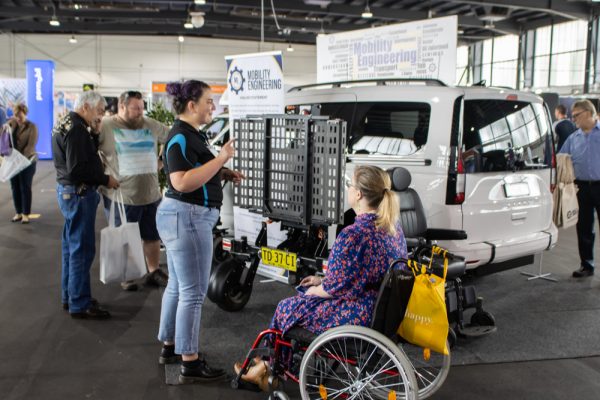 Mobility Engineering staff showcasing their accessible vehicle to visitors - ATSA Expo Canberra 2021 image gallery