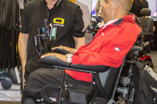Two men talking and smiling whilst on the expo floor
