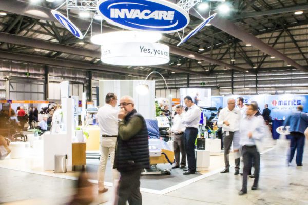 Crowd of visitors at Invacare expo stand