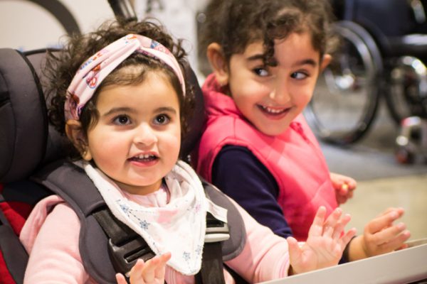 Photo of two children smiling whilst attending ATSA Sydney