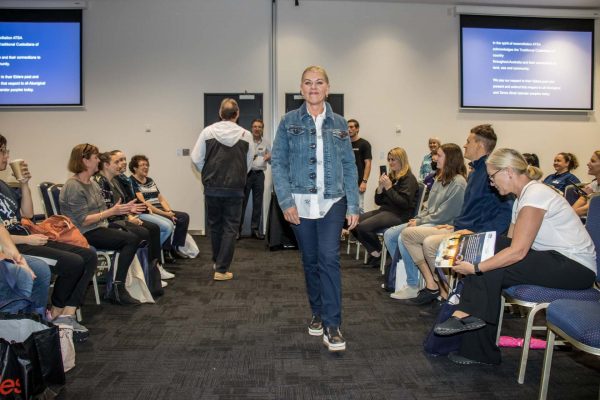 Woman showcasing an adaptive clothing item at fashion show gallery - ATSA Expo Brisbane 2022