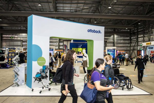 Ottobock exhibition stand with wheelchairs on display