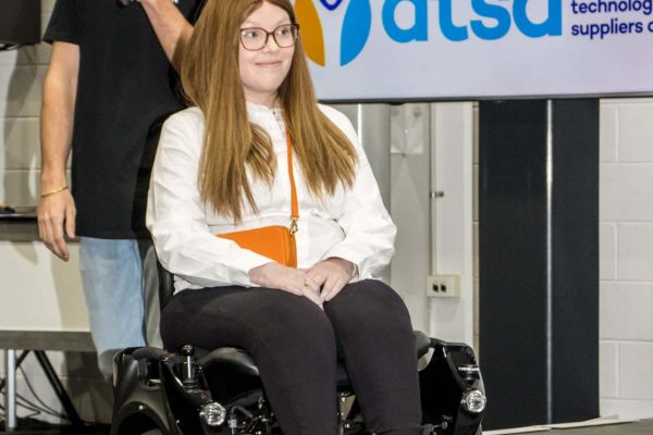 Wheelchair user modelling adaptive clothing during EveryHuman fashion gallery